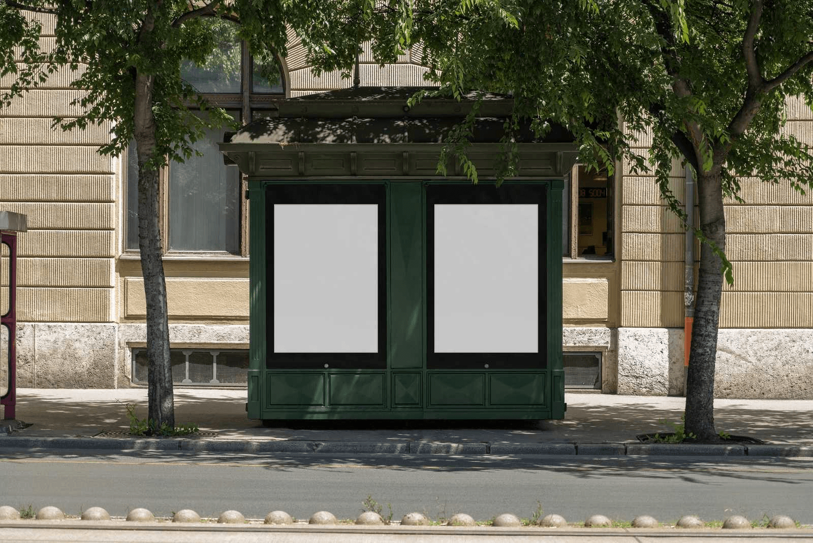 A green street newsstand displaying two posters