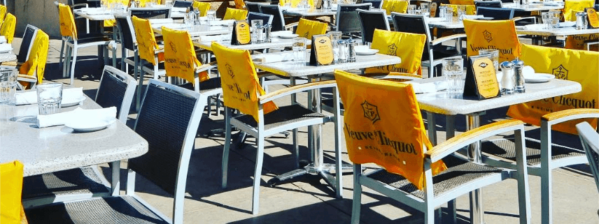 Grab a table at Ajax Tavern's patio